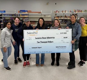 Donation check presentation to Lazarus House Ministries