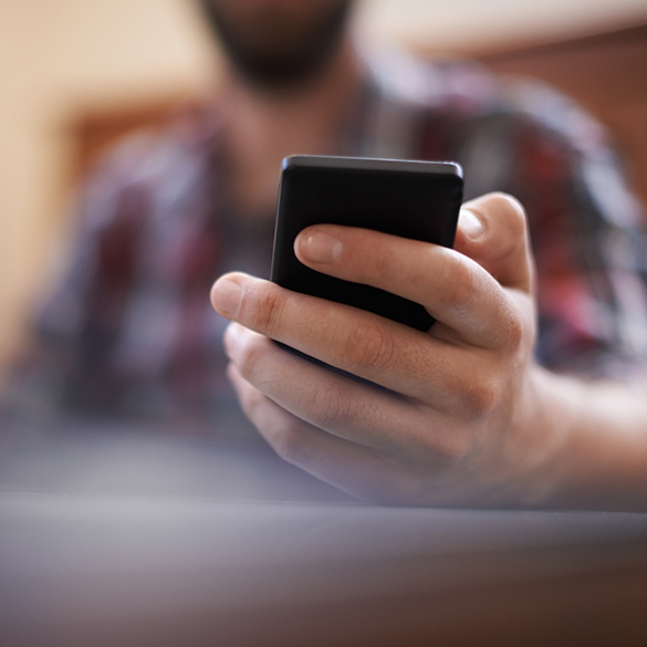 Man holding cell phone.