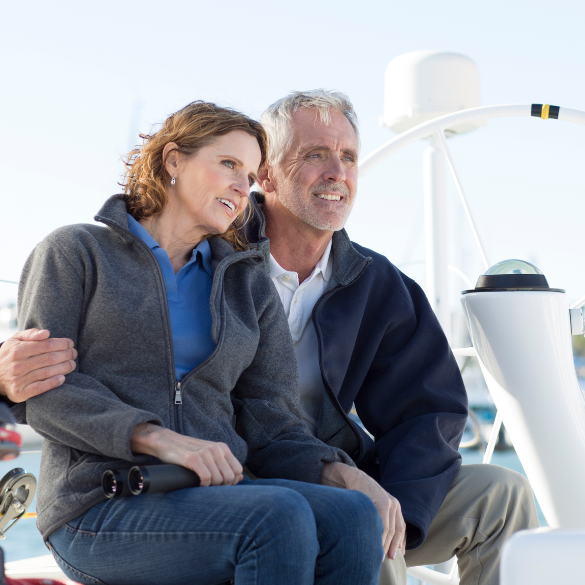 Mature couple sitting on a boat.